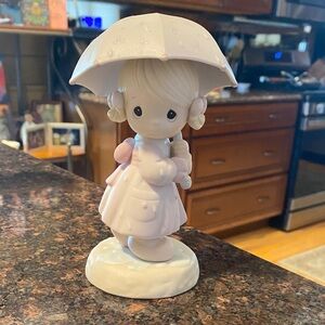 VINTAGE Precious Moments "April" figurine, featuring a girl with an umbrella.